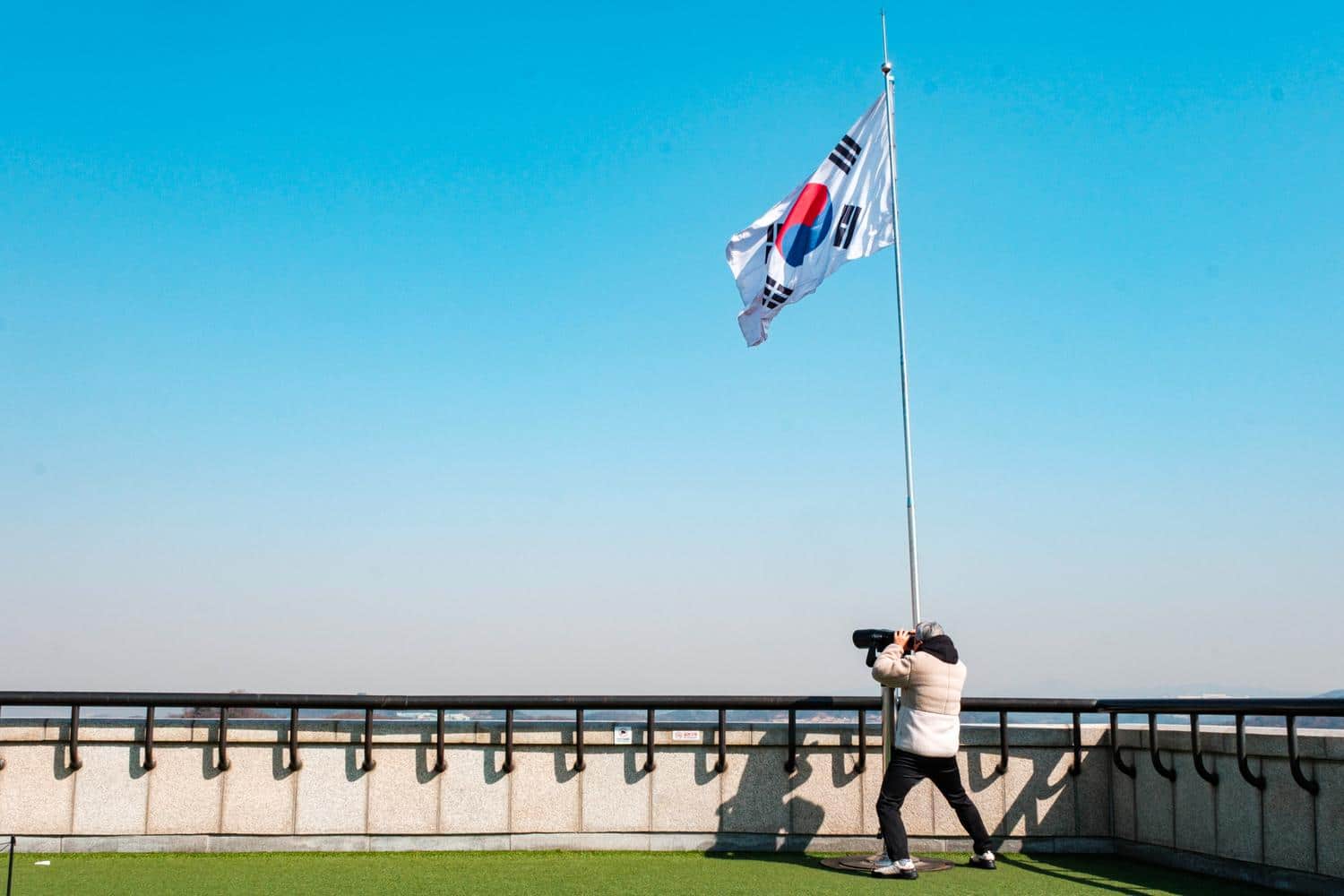 A visitor watches North Korea through a telescope at Odusan Unification Observatory.