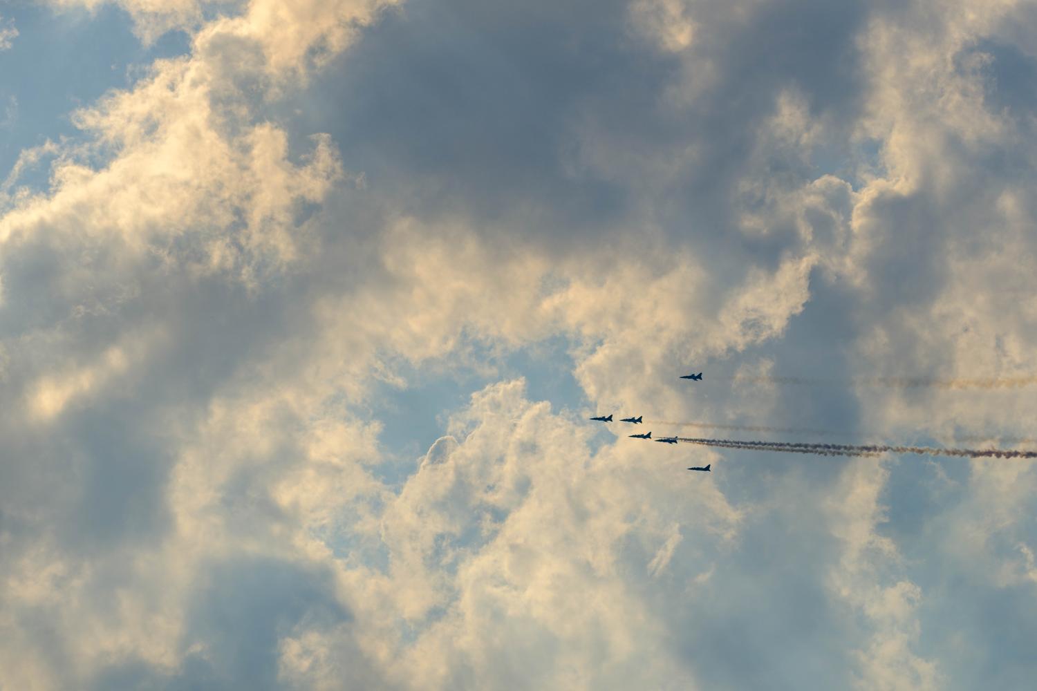 Jets from South Korea's Black Eagles aerobatic team fly in a cloudy sky over Seoul.