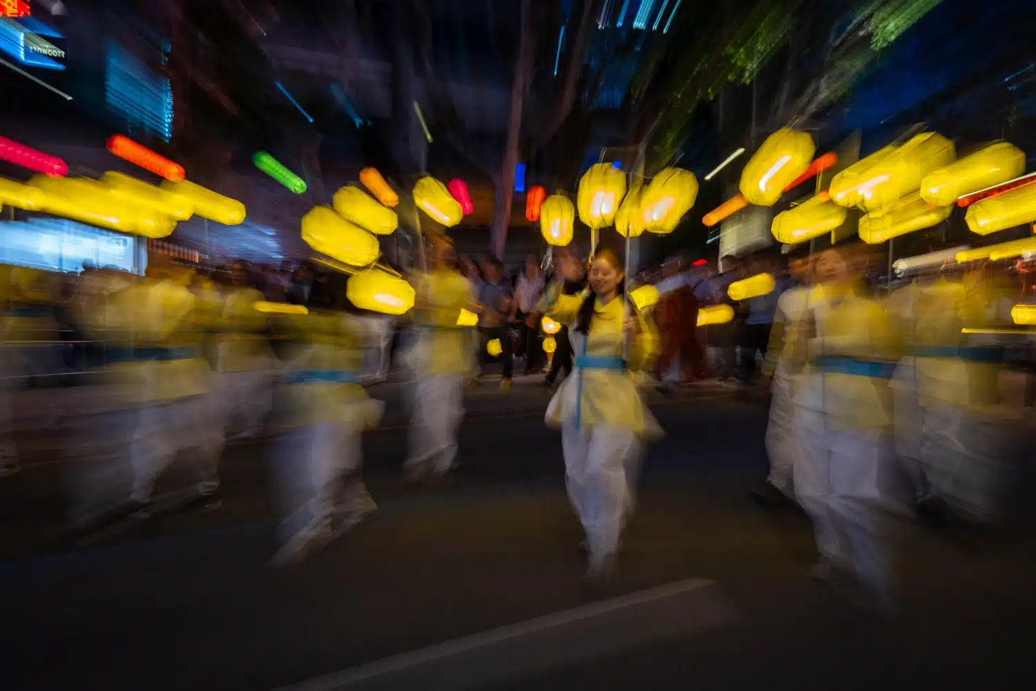 seoul-lotus-lantern-festival-2026-14 People parade through the streets of Seoul at night carrying lanterns during the Lotus Lantern Festival, which marks Buddha's birthday in May.