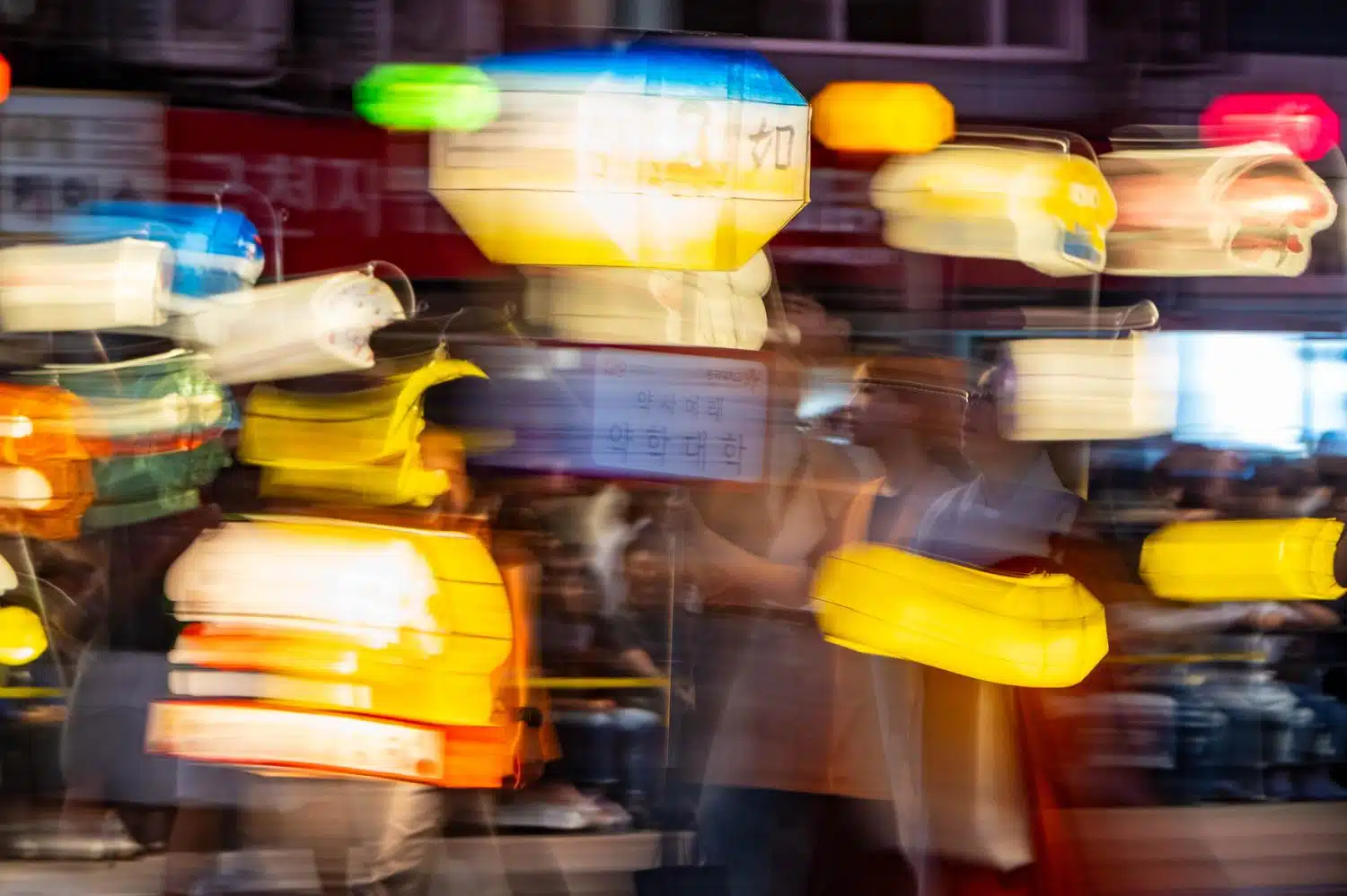 seoul-lotus-lantern-festival-2026-15 People parade through the streets of Seoul at night carrying lanterns during the Lotus Lantern Festival, which marks Buddha's birthday in May.