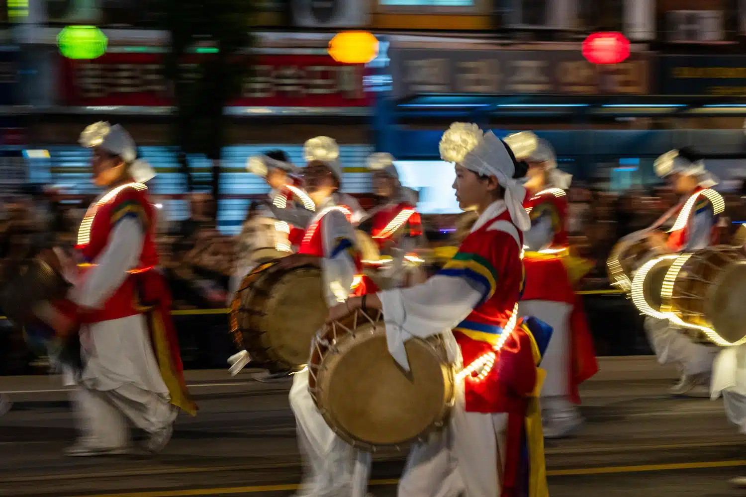 seoul-lotus-lantern-festival-2026-22 People parade through the streets of Seoul at night carrying lanterns during the Lotus Lantern Festival, which marks Buddha's birthday in May.
