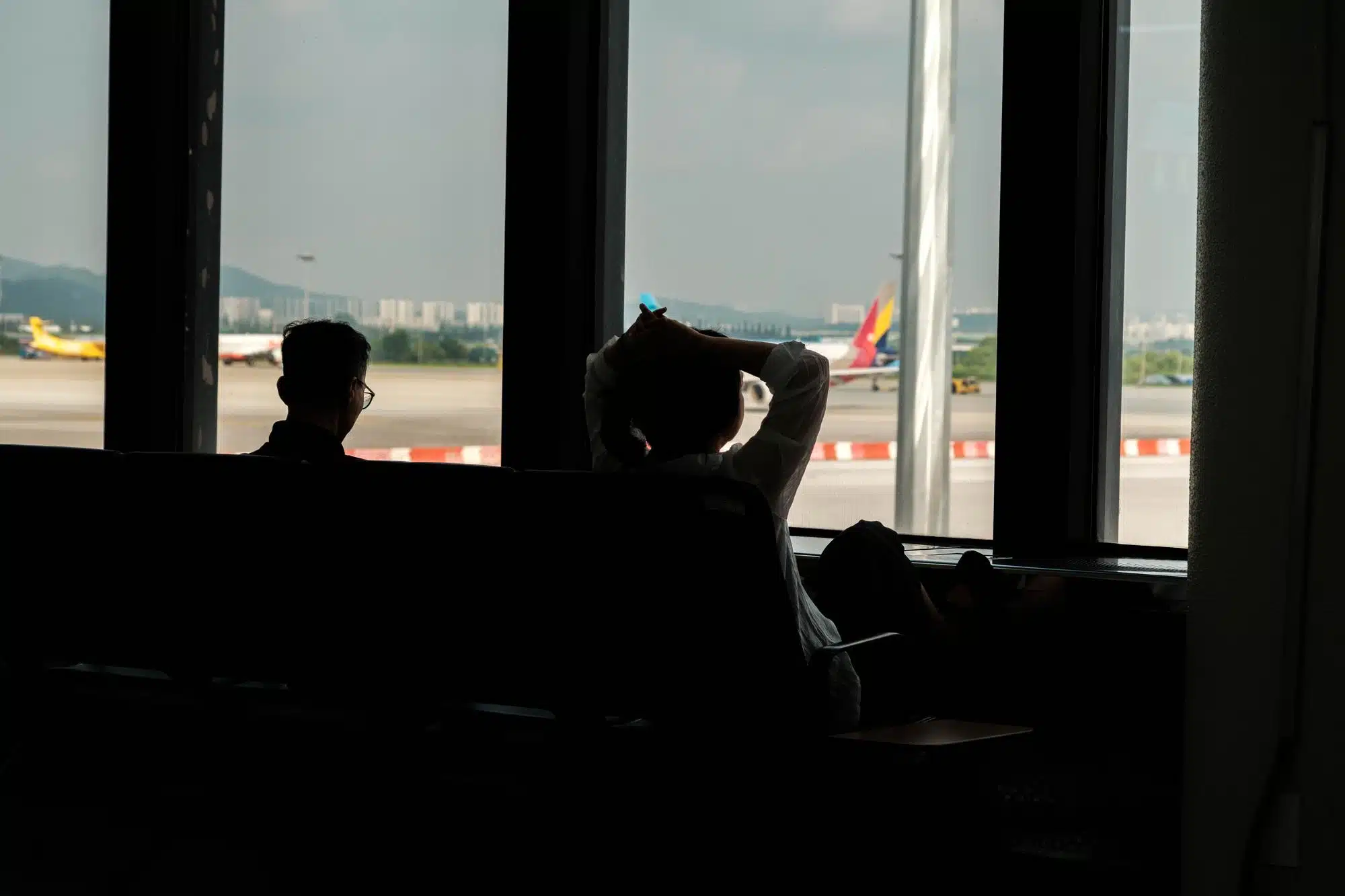 seoul-gimpo-airport-gate Passengers relax while waiting for boarding at Seoul Gimpo airport.